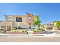 Charming townhouse featuring desert landscaping, covered balcony, and a stylish, modern facade at 12126 Azure Gate Rd # 1, Las Vegas, NV 89183