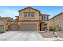 Inviting two-story home with a charming facade and a spacious three car driveway at 1547 Harwood Ave, Henderson, NV 89012