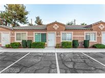 Charming townhome exterior with lush landscaping and a private entrance at 2110 Sleepy Ct, Las Vegas, NV 89106