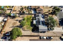 Expansive aerial view of the property featuring a house with solar panels and a spacious backyard at 3100 Garehime St, Las Vegas, NV 89108