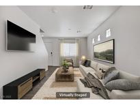 Bright living room features neutral tones, modern decor, and a cozy atmosphere at 5135 Paradise Valley Ave, Las Vegas, NV 89156