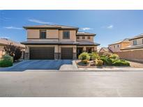 Stunning two-story home featuring a well-manicured front yard, multi-car garage, and neutral color palette in a quiet neighborhood at 7256 Bugler Swan Way, North Las Vegas, NV 89084