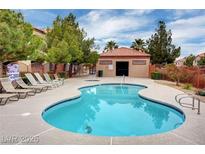 Community pool with lounge chairs, a spa, and a cabana, perfect for relaxation and social gatherings at , Las Vegas, NV 89118