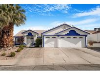 Charming single-Gathering home featuring white paint and blue trim plus a large, three car garage at 182 Horizon View Dr, Henderson, NV 89015