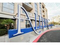 Modern high-rise condo building with striking entrance signage and well-maintained landscaping at 200 W Sahara Ave # 1810, Las Vegas, NV 89102