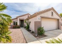 Charming single story home with desert landscaping and inviting walkway to the front door at 2105 High Mesa Dr, Henderson, NV 89012