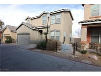 Charming two-story home with a well-maintained front yard and a two-car garage at 2520 Living Rock St, Las Vegas, NV 89106