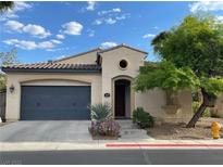 Charming single-story home featuring a well-kept front yard and a two-car garage at 519 Via Garofano Ave, Henderson, NV 89011