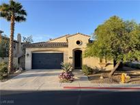 Charming single-story home with desert landscaping, attached garage, and inviting entrance at 519 Via Garofano Ave, Henderson, NV 89011