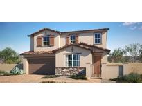 Inviting two-story home featuring a stone facade, charming window shutters, and a well-manicured front yard at 765 Cloud Creek St, Henderson, NV 89011