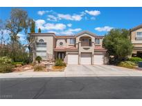 Beautiful two-story home with three-car garage, tile roof and well-manicured landscaping at 1392 Via Merano St, Henderson, NV 89052