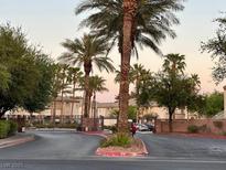 Gated entrance with palm trees and well-maintained landscaping at 3400 Cabana Dr # 1061, Las Vegas, NV 89122