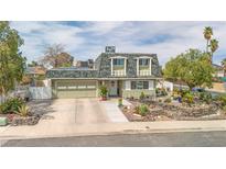 Charming two-story home featuring a well-maintained yard and attached two car garage at 4394 El Campana Way, Las Vegas, NV 89121