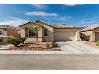 Charming single-story home with a desert-landscaped front yard, tile roof, and two-car garage at 7386 Campbell Ranch Ave, Las Vegas, NV 89179