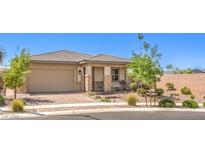 Charming single-story home featuring a desert landscape, brick driveway, and two-car garage at 797 Drammatico Pl, Henderson, NV 89011
