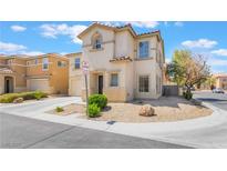 Charming two-story home featuring low maintenance landscaping and a quaint front facade at 9785 Iron Mine St, Las Vegas, NV 89183