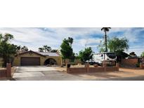 Charming single-story home featuring a well-manicured front yard and a private driveway at 5312 Manuel Dr, Las Vegas, NV 89149
