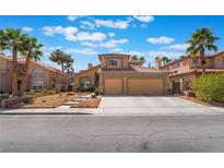 Charming two-story home with a well-manicured front yard and a two car garage at 8277 Mount Nido Dr, Las Vegas, NV 89147