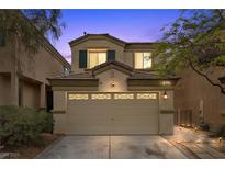 Charming two-story home featuring a spacious two-car garage and well-maintained landscaping at 9060 Watermelon Seed Ave, Las Vegas, NV 89143