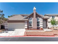 Charming single-Gathering home with a two-car garage and a well-maintained front yard at 121 Golf Course St, Las Vegas, NV 89145