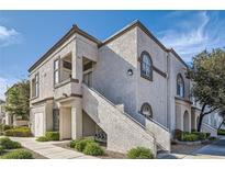 Charming two-story condo building showcasing stucco, private entrances, and well-maintained landscaping at 3125 N Buffalo Dr # 1133, Las Vegas, NV 89128