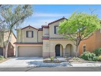 Charming two-story home featuring a stucco exterior, attached garage, and well-manicured landscaping at 7173 Las Colinas Ave, Las Vegas, NV 89179