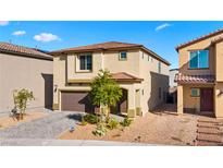 Charming two-story home with a well-manicured front yard and a two-car garage in a residential neighborhood at 7714 Duran Harbor Ln, North Las Vegas, NV 89084