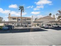 Exterior shot showcasing the covered parking area available to residents, and the exterior of the property at 913 Boulder Springs Dr # 202, Las Vegas, NV 89128