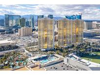 Stunning aerial view of a luxury high-rise with a pool and Las Vegas skyline at 145 E Harmon Ave # 3103, Las Vegas, NV 89109
