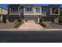 Charming townhome featuring a private garage and well-maintained landscaping at 3783 Canis Minor Ln # 6104, Henderson, NV 89052