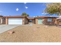 Charming single-story home with a well-maintained front yard and attached garage in a suburban neighborhood at 4000 Twain Ave, Las Vegas, NV 89121
