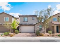 Charming two-story home with stone accents, a two-car garage, and a well-manicured front yard at 7132 Sayonara Vista St, North Las Vegas, NV 89084