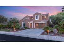 Beautiful two-story home featuring a three-car garage and well-maintained desert landscaping at 9 Contra Costa Pl, Henderson, NV 89052