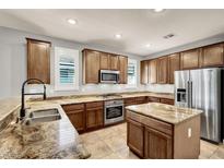 Features granite countertops, stainless steel appliances and lots of cabinet space for optimal storage at 7806 Sundial Peak St, Las Vegas, NV 89166