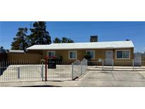 Charming single-story home featuring a new roof, white fence and desert landscaping at 5157 New Bedford Dr, Las Vegas, NV 89122