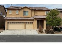 Charming two-story home featuring a three-car garage and well-maintained landscaping at 108 Spur Ranch Ave, North Las Vegas, NV 89032