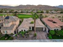 Stunning single-Gathering home featuring a desert landscaped yard, a tile roof, and an attached two-car garage at 2885 Red Springs Dr, Las Vegas, NV 89135