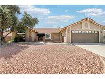 Charming single-story home with a well-manicured yard, two car garage, and tile roof at 3249 Palmdesert Way, Las Vegas, NV 89120