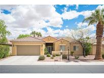 Charming single-story home with a well-manicured front yard, desert landscaping, and a tile roof at 3696 Waynesvill St, Las Vegas, NV 89122