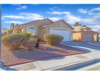 Charming single-story home with a two-car garage and low maintenance desert landscaping at 3741 Round Robin St, North Las Vegas, NV 89032