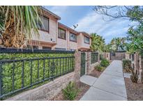 Charming two-story townhome with well-maintained landscaping and gated entrance at 4338 Caliente St # 11, Las Vegas, NV 89119