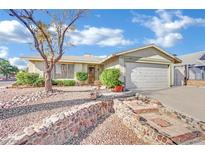 Charming single-story home featuring a two car garage and a low maintenance landscaped front yard at 4623 Kearney St, Las Vegas, NV 89147