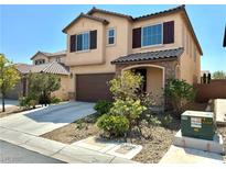 Charming two-story home featuring a two-car garage, covered porch, and desert landscaping at 7253 Blooming Jasmine Ave, Las Vegas, NV 89117