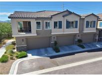 Charming townhome showcasing a tile roof, paired shutters, and a well-maintained front yard at 7334 N Decatur Blvd # 6, Las Vegas, NV 89131