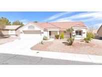 Charming single-story home with a desert landscaped front yard and a red tile roof at 8508 Glenmore Dr, Las Vegas, NV 89134