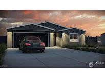 Charming single-story home with a two-car garage, modern design, and well-maintained landscaping at 1280 S Yosemite Ave, Pahrump, NV 89048