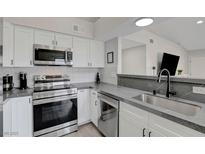Modern kitchen featuring stainless steel appliances and white cabinets at 1575 W Warm Springs Rd # 1124, Henderson, NV 89014