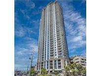 Striking high-rise building with modern architecture, balconies, and abundant windows under a blue, partly cloudy sky at 200 W Sahara Ave # 3312, Las Vegas, NV 89102
