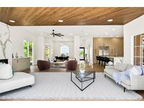 Spacious living room featuring modern decor, wood ceiling and open floor plan at 2937 Billy Casper Dr, Las Vegas, NV 89134