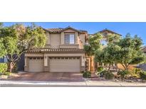 Charming two-story home featuring a three-car garage and meticulously maintained landscaping at 396 Via Sonador, Henderson, NV 89012